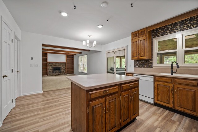 848 Stewart St, Batavia, IL 60510 - kitchen with white dishwasher, light wood-type flooring, a sink, light countertops, and recessed lighting