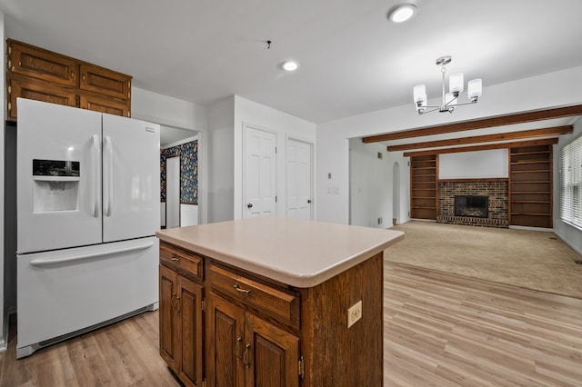848 Stewart St, Batavia, IL 60510 - kitchen featuring white refrigerator with ice dispenser, light wood-type flooring, a chandelier, a center island, and light countertops