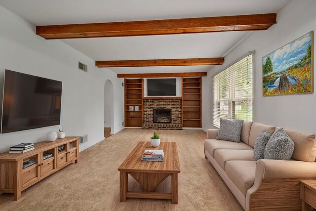 848 Stewart St, Batavia, IL 60510 - living room featuring arched walkways, beam ceiling, light colored carpet, and a brick fireplace