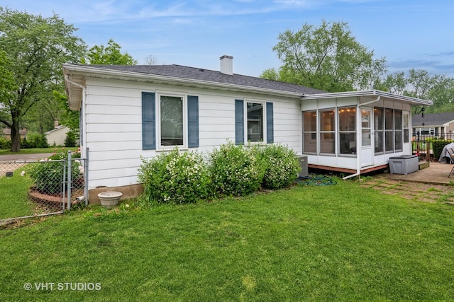 224 Howard Ave, East Dundee, IL 60118 - back of house with a sunroom and a chimney