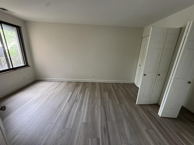 420 Walnut Creek Ln Unit 3103, Lisle, IL 60532 - unfurnished bedroom with wood finished floors and baseboards
