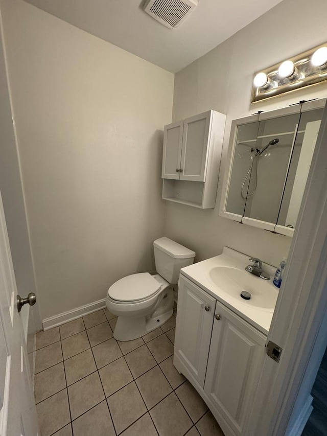 420 Walnut Creek Ln Unit 3103, Lisle, IL 60532 - bathroom with toilet, vanity, tile patterned floors, a shower, and baseboards