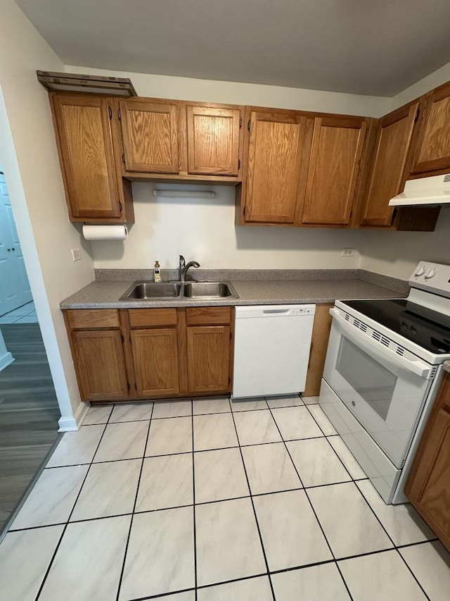 420 Walnut Creek Ln Unit 3103, Lisle, IL 60532 - kitchen with white appliances, a sink, under cabinet range hood, and brown cabinets