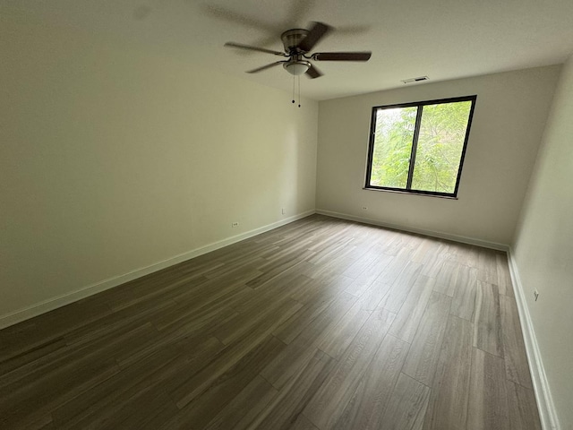420 Walnut Creek Ln Unit 3103, Lisle, IL 60532 - spare room featuring baseboards, dark wood finished floors, and a ceiling fan