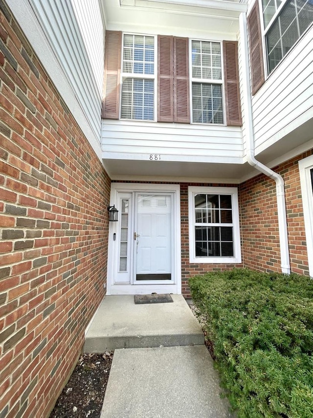 entrance to property with brick siding