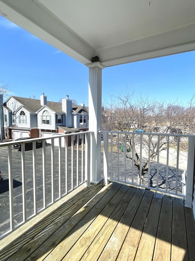 wooden terrace with a residential view