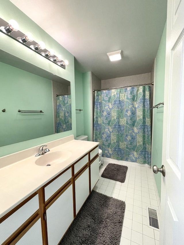 full bathroom with vanity, toilet, tile patterned floors, a shower with curtain, and visible vents