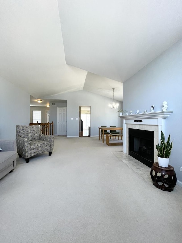 carpeted living area featuring an inviting chandelier, baseboards, lofted ceiling, and visible vents