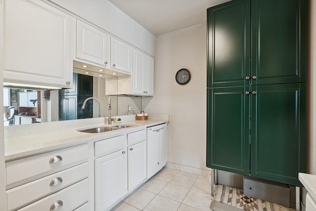 1240 N Lake Shore Dr Unit 9B, Chicago, IL 60610 - kitchen with white dishwasher, light countertops, a sink, white cabinets, and green cabinets