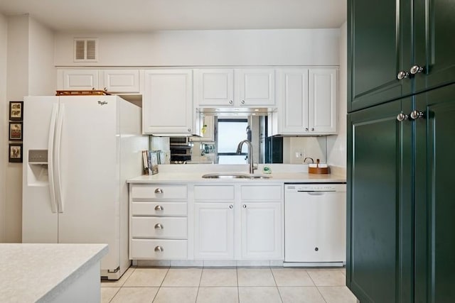 1240 N Lake Shore Dr Unit 9B, Chicago, IL 60610 - kitchen featuring a sink, white appliances, light countertops, white cabinetry, and visible vents