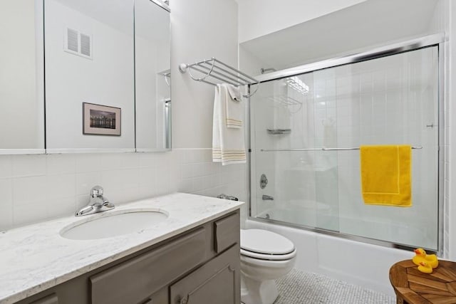 1240 N Lake Shore Dr Unit 9B, Chicago, IL 60610 - full bath featuring visible vents, vanity, tile patterned floors, toilet, and shower / bath combination with glass door