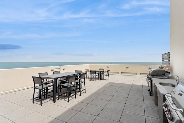 1240 N Lake Shore Dr Unit 9B, Chicago, IL 60610 - view of patio with area for grilling, a water view, outdoor dining space, and a view of the beach