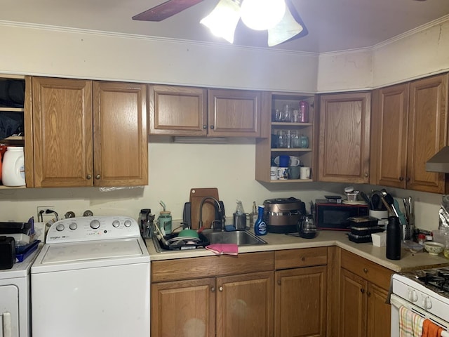 kitchen with separate washer and dryer, open shelves, a sink, and light countertops