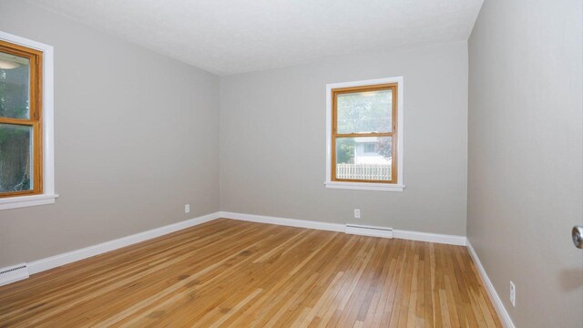 1201 S Mercer Ave, Bloomington, IL 61701 - unfurnished room featuring light wood-style floors and baseboards