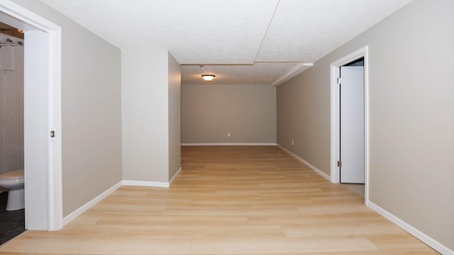 1201 S Mercer Ave, Bloomington, IL 61701 - hall with light wood-style floors and baseboards