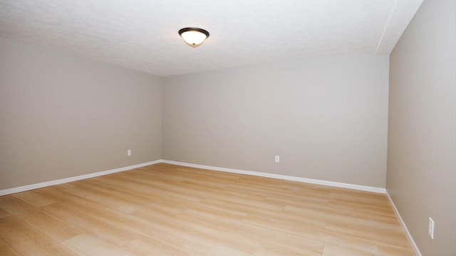 1201 S Mercer Ave, Bloomington, IL 61701 - spare room with light wood-type flooring and baseboards