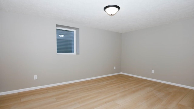 1201 S Mercer Ave, Bloomington, IL 61701 - unfurnished room featuring light wood-style flooring and baseboards