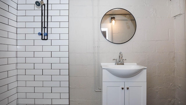 1201 S Mercer Ave, Bloomington, IL 61701 - bathroom featuring vanity and tiled shower