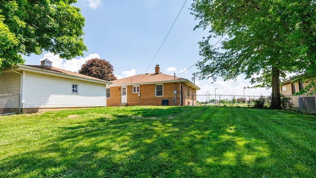 1201 S Mercer Ave, Bloomington, IL 61701 - back of property featuring a chimney and cooling unit