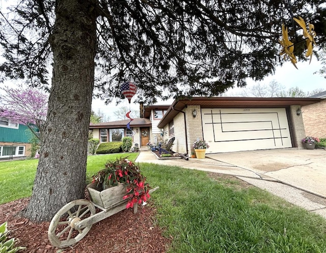 view of front of property with an attached garage, concrete driveway, a front yard, and brick siding
