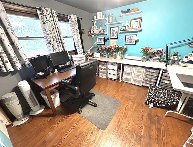office with a healthy amount of sunlight and wood finished floors