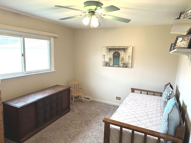 bedroom with baseboards, carpet, and a ceiling fan