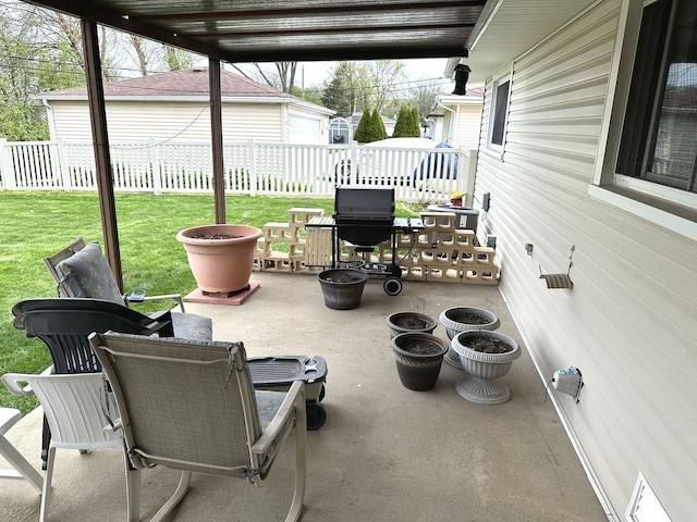 view of patio / terrace featuring fence