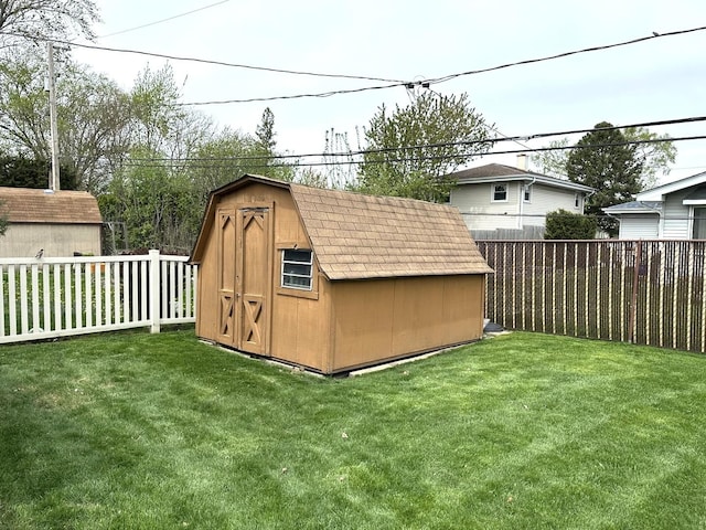 view of shed featuring a fenced backyard