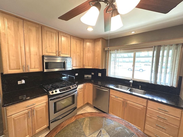kitchen with ceiling fan, recessed lighting, a sink, appliances with stainless steel finishes, and backsplash