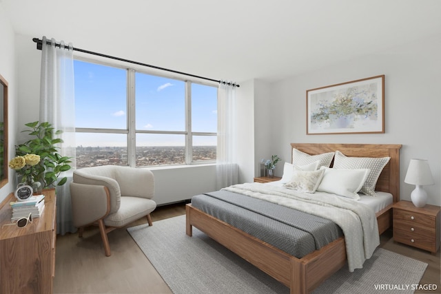 655 W Irving Park Rd Unit 4417, Chicago, IL 60613 - bedroom with light wood-type flooring