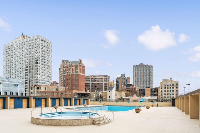 655 W Irving Park Rd Unit 4417, Chicago, IL 60613 - view of swimming pool featuring a view of city and a community hot tub