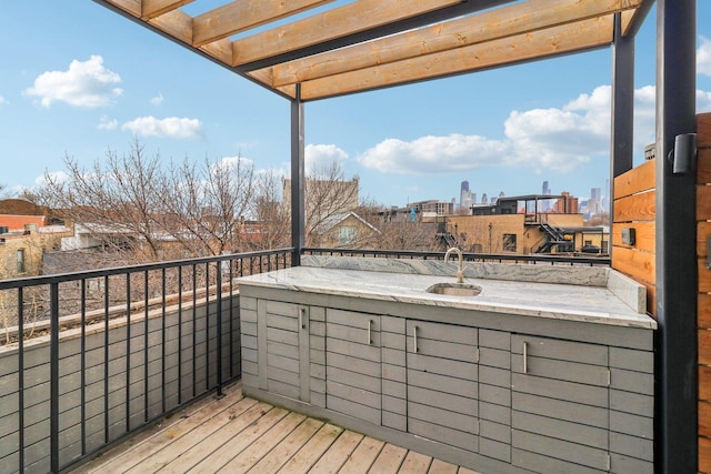 deck featuring a view of city and a sink