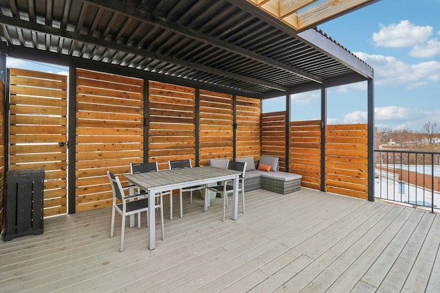 wooden terrace featuring outdoor dining area