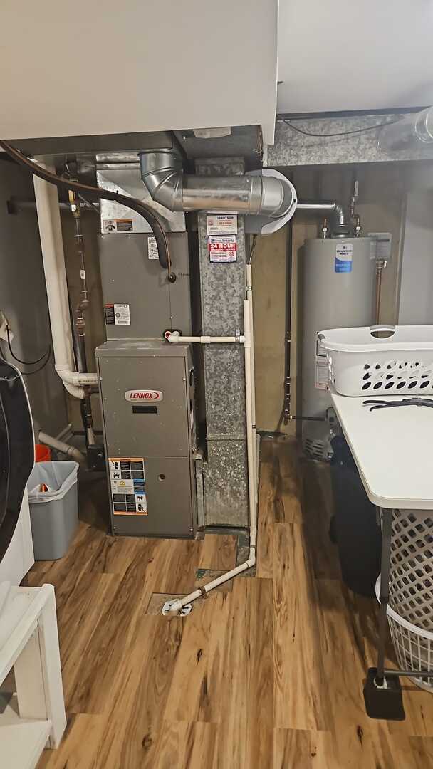 7013 W Greenleaf Ave, Niles, IL 60714 - utility room featuring heating unit and water heater