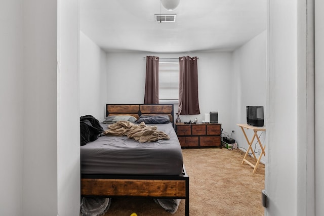 carpeted bedroom with visible vents