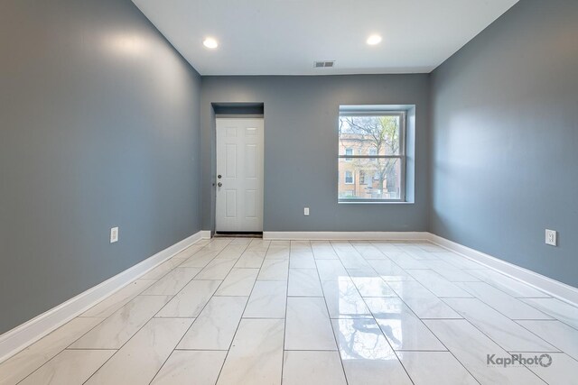 unfurnished room with baseboards, recessed lighting, and visible vents