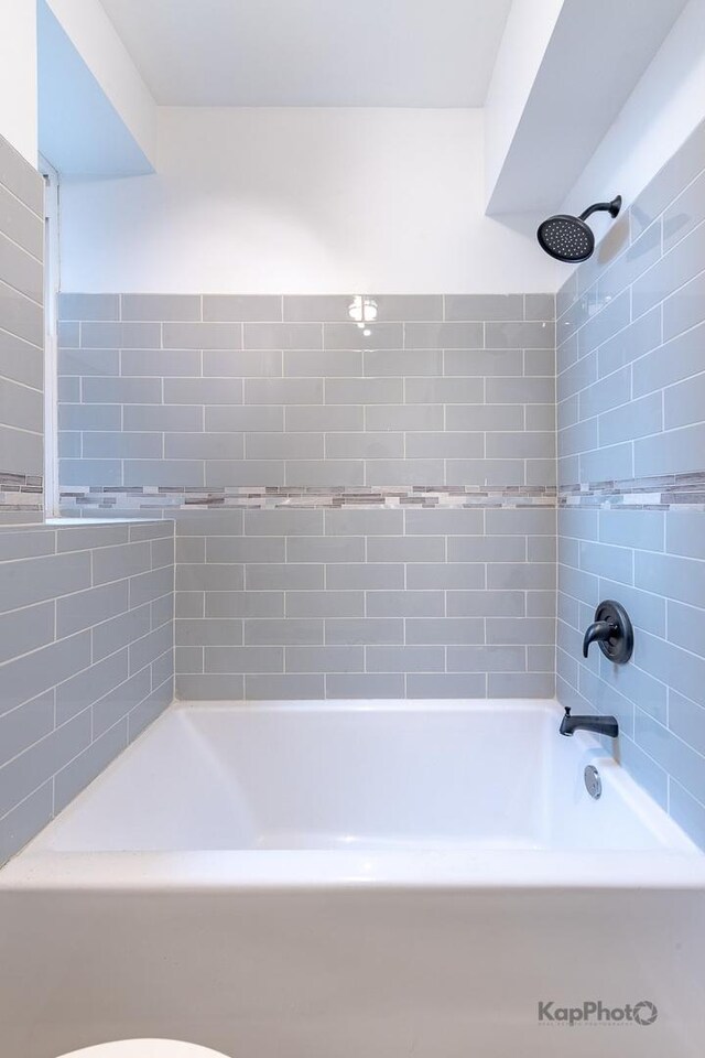 full bath with bathing tub / shower combination