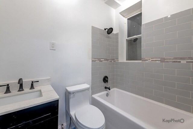 bathroom with vanity, toilet, and shower / washtub combination
