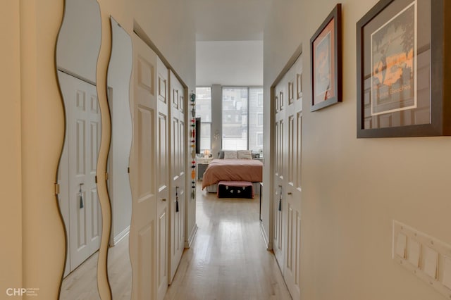 hall with light wood-type flooring