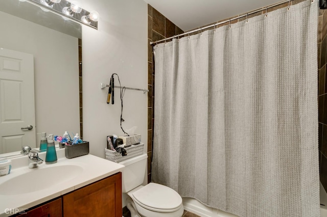bathroom featuring vanity, toilet, and shower / tub combo with curtain