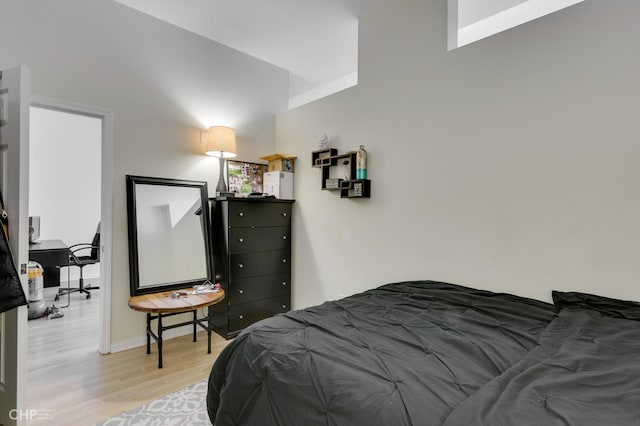 bedroom with light wood-type flooring