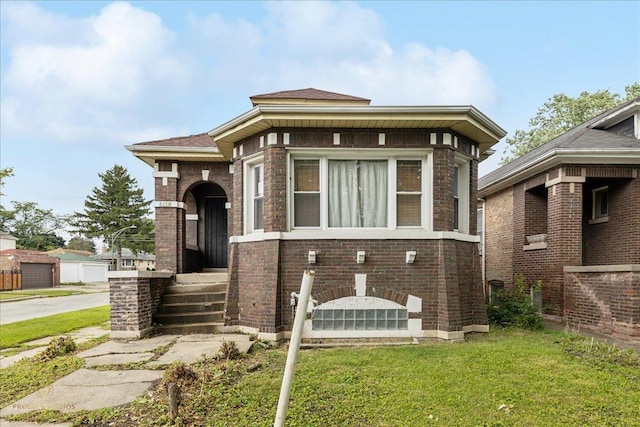 8358 S Ada St, Chicago, IL 60620 - view of front facade featuring a front yard and brick siding