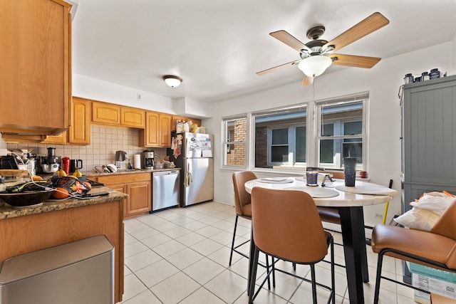 2642 N Harlem Ave Unit 2W, Elmwood Park, IL 60707 - kitchen featuring a sink, light tile patterned flooring, tasteful backsplash, a ceiling fan, and appliances with stainless steel finishes