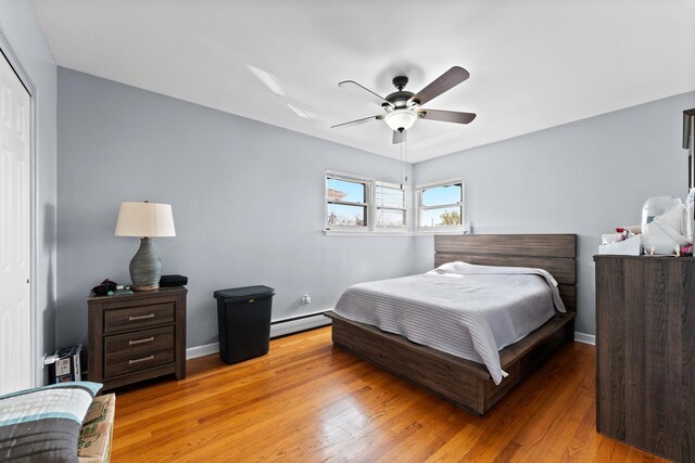 2642 N Harlem Ave Unit 2W, Elmwood Park, IL 60707 - bedroom with ceiling fan, light wood-style flooring, baseboards, a baseboard heating unit, and a closet