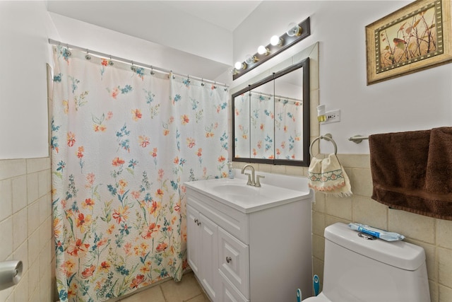 2642 N Harlem Ave Unit 2W, Elmwood Park, IL 60707 - bathroom featuring vanity, toilet, tile walls, a wainscoted wall, and tile patterned floors