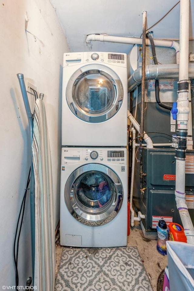 washroom featuring laundry area and stacked washer / dryer
