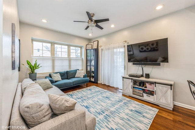 living room with recessed lighting, a ceiling fan, baseboards, and wood finished floors