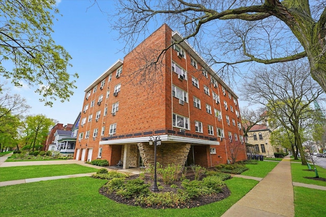 view of building exterior featuring a garage and concrete driveway