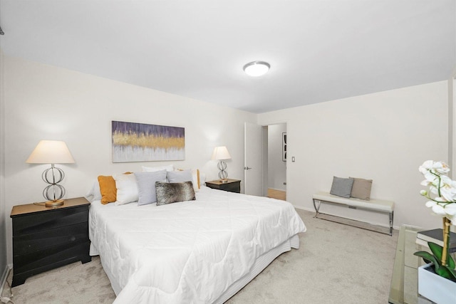 carpeted bedroom with baseboards