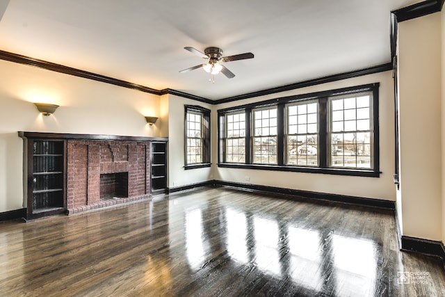 unfurnished living room featuring crown molding, a ceiling fan, baseboards, and wood finished floors